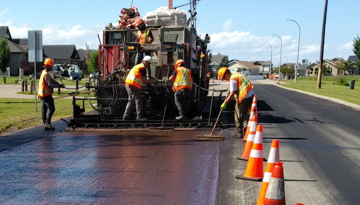 Roads crew micro-surfacing a road