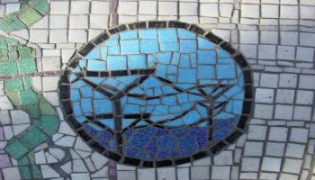 Glass mosaic tiles layed out to look like fish.