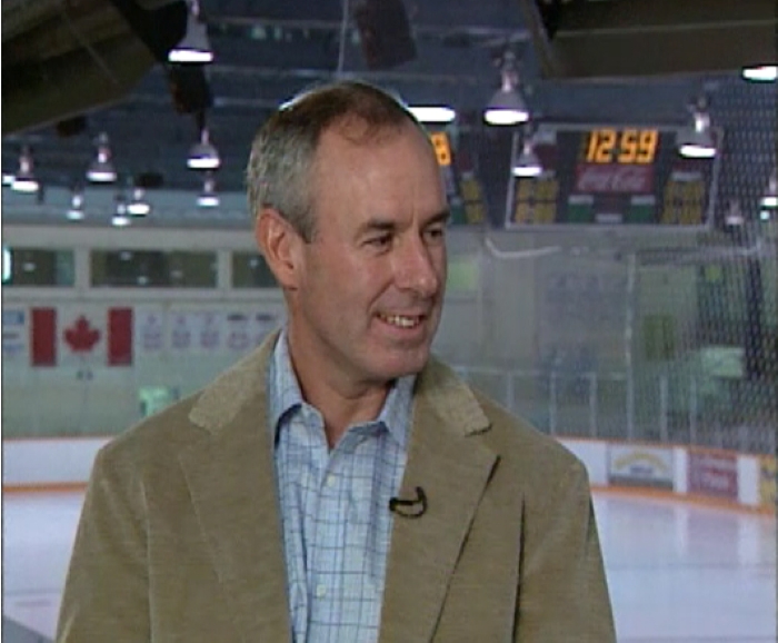Colour photo of a Ron McLean interviewed at the Red Deer Arena