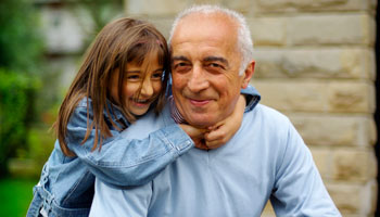 Girl hugging her Grandfather