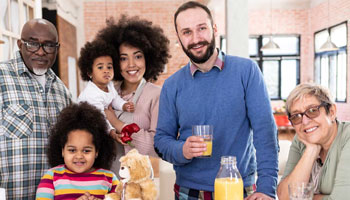 Small group of diverse people of all ages enjoying a meal