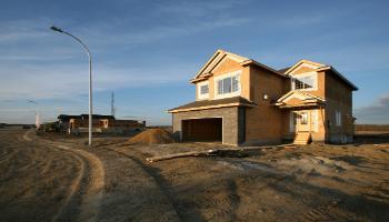 A house that has been framed in a new subdivision