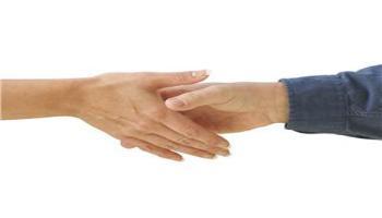 Two people shaking hands for a deal