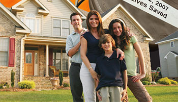 Family outside of burning house