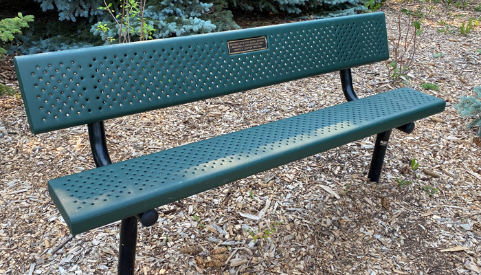 A photo of a memorial bench