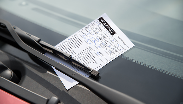 Parking ticket on vehicle windshield