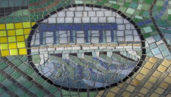 Glass mosaic tile designed to look like a dam.