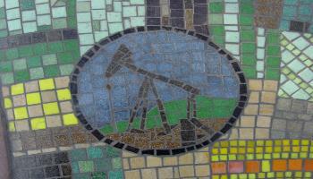 Glass mosaic tile designed to look like an oil pumpjack.