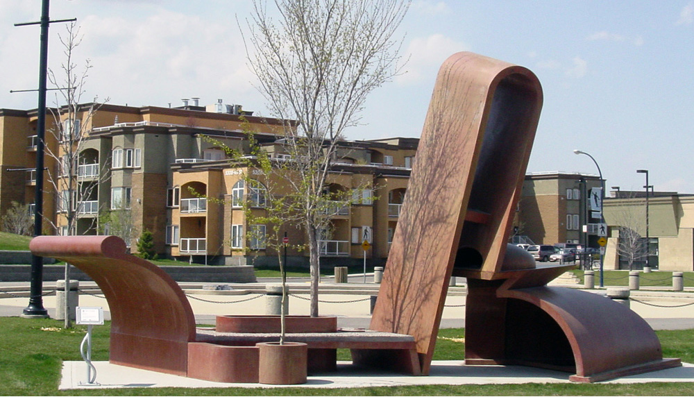 Carbon steel sculpture that is using simple shapes put together abstractly to represent a train.