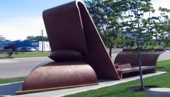 Carbon steel sculpture that is using simple shapes put together abstractly to represent a train.