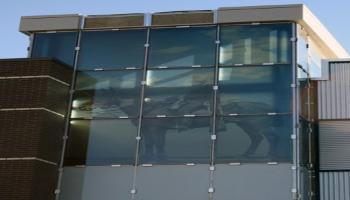 Glass windows with an RCMP officer on horseback etched in the glass.