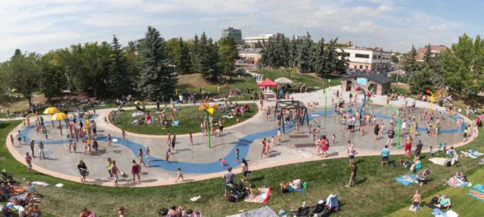 lots of people enjoying the Blue Grass Sod Farms Central Alberta Spray and Play park area