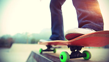 Photo of a two feet standing on a skateboard