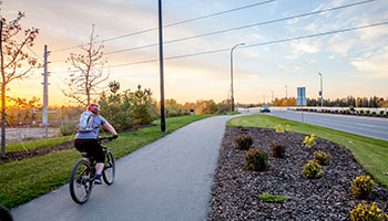 Woman on bike cycling downtown